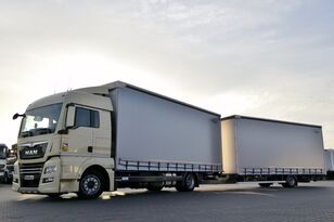 شاحنة ذات أغطية جانبية MAN TGX 18.360 / JUMBO TRUCK 120 M3 / VEHICULAR / MANUAL / LOAD: 14 + مقطورة ستارة